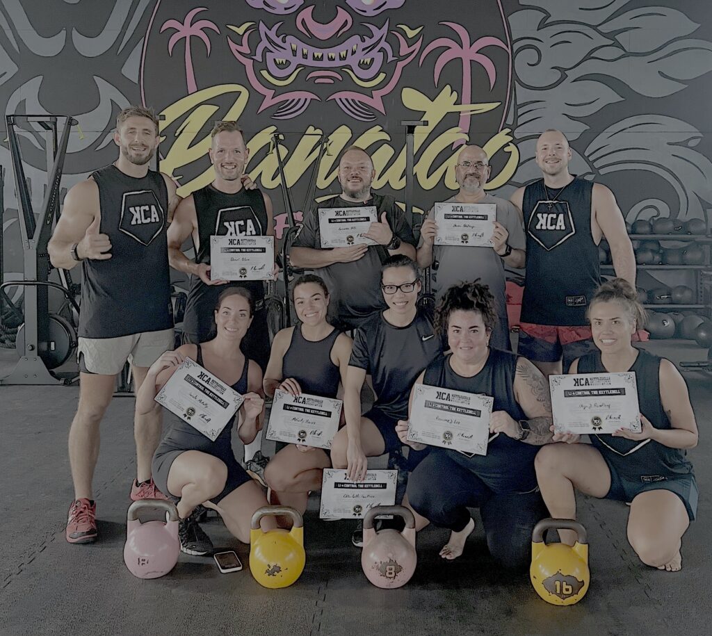 Participants of the KCA Level 1 Foundation Certification posing together and holding their certificates after completing the seminar with Peter Forneck.